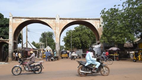 Motor bike riders drive past Kofar Kade, a city gate in ancient Sokoto, Nigeria, on September 21, 2021. (Getty Images)