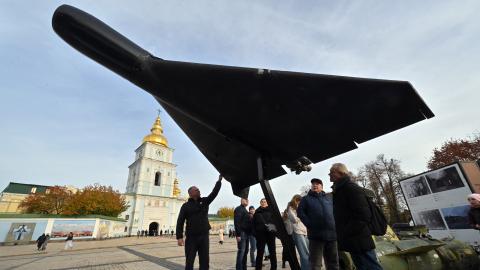 People look at an Iranian-designed Shahed 136, (Geranium-2) drone of Russian Army at an open-air exhibition of destroyed Russian equipment near Saint Michael's Golden-Domed Cathedral in Kyiv on November 2, 2025, amid the Russian invasion of Ukraine. (Photo by Sergei SUPINSKY / AFP) (Photo by SERGEI SUPINSKY/AFP via Getty Images)