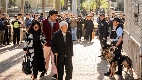 Teresa Lai and Lai Shun-yan, the respective wife and son of Jimmy Lai, and Cardinal Joseph Zen, the former bishop of Hong Kong, arrive at the West Kowloon Law Courts building in Hong Kong on December 15, 2025. (Getty Images)