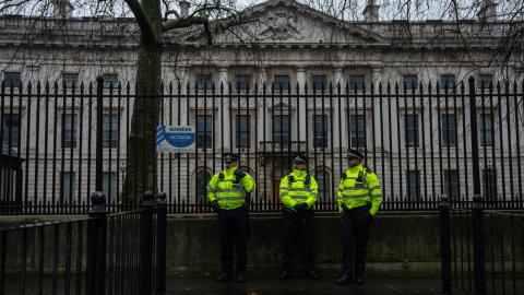 Caption Police officers stand watch during a demonstration at the proposed site of China's embassy on February 8, 2025, in London, England. (Getty Images) Share to Twitter