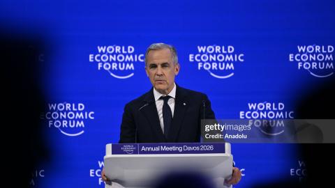 : Canadian Prime Minister Mark Carney delivers a speech at the World Economic Forum Annual Meeting held in Davos, Switzerland on January 20, 2026. (Photo by Harun Ozalp/Anadolu via Getty Images)