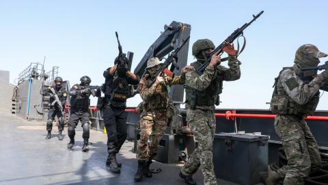 Caption Naval units from Iran and Russia carry out joint naval drills at the Port of Bandar Abbas near the Strait of Hormuz in Hormozgan, Iran, on February 19, 2026. (Getty Images) Share to Twitter