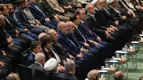 Iran's new President, Masoud Pezeshkian, is looking on while sitting next to Iranian officials during the swearing-in ceremony in Tehran, Iran, on July 30, 2024. (Photo by Morteza Nikoubazl/NurPhoto via Getty Images)