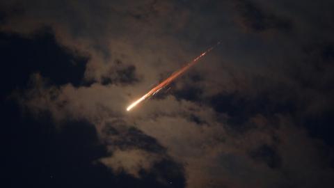 Caption Some of the missiles launched from Iran are spotted in the skies on February 28, 2026, in the West Bank. (Getty Images) Share to Twitter