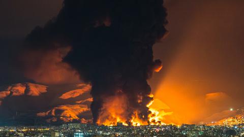 Smoke and flames rise at the site of airstrikes on an oil depot in Tehran on March 7, 2026. (Getty Images)