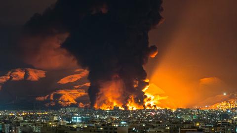 Smoke and flames rise at the site of airstrikes on an oil depot in Tehran on March 7, 2026. (Getty Images)