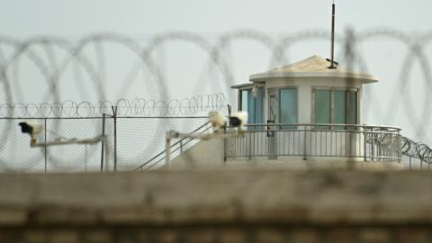 This picture taken on July 19, 2023 shows a view of a watchtower of an alleged detention facility in Artux in Kizilsu Prefecture in China's northwestern Xinjiang region. Since 2017, more than a million Uyghurs and other Muslims have been swept into internment camps where human rights abuses are commonplace, researchers, campaigners and members of the diaspora say. Beijing says the facilities were voluntary centres for teaching vocational skills, closed years ago after their inhabitants "graduated" into stab