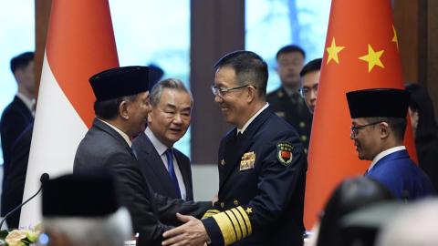 Indonesian Defense Minister Sjafrie Sjamsoeddin(L) and Chinese Defense Minister Dong Jun (3rd L) shake hands as Chinese Foreign Minister Wang Yi (2nd L) and Indonesian Foreign Minister Sugiono(R) look on after a press briefing after the first meeting of China-Indonesia joint foreign and defense ministerial dialogue at the Diaoyutai State Guest House on April 21, 2025 in Beijing, China. (Photo by Iori Sagisawa - Pool/Getty Images)