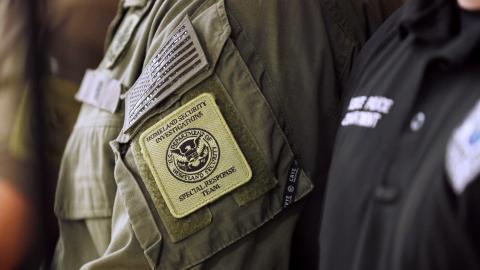 A member of the Homeland Security Investigations Special Response Team is seen wearing his uniform during Department of Homeland Security Secretary Kristi Noem's press conference at a federal office building on October 20, 2025 in Bradenton, Florida. The Secretary addressed ongoing immigration enforcement efforts and federal coordination with local authorities across the state, while praising President Donald Trump for their joint accomplishments under the "One, Big, Beautiful Bill," which received congress