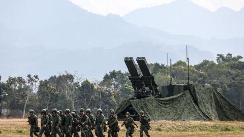 Taiwanese soldiers walk past a Sky Sword II Land-based Air Defence Missile in Taichung on January 27, 2026. (Photo by I-Hwa Cheng / AFP via Getty Images)