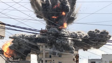 A fireball rises from a building hit by an Israeli airstrike in the area of Abbasiyeh, on the outskirts of the southern Lebanese city of Tyre, on April 8, 2026. Lebanon's army warned people against returning to the country's south on April 8, where the Israeli military is still launching attacks, as Israel said the ceasefire with Iran did not include its conflict with Hezbollah. (Photo by Kawnat HAJU / AFP via Getty Images)