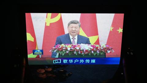 News footage on a giant screen outside a shopping mall in Beijing shows China's President Xi Jinping speaking during an event with General Secretary of the Communist Party of Vietnam and Vietnam's President To Lam on April 15, 2026. (Photo by Pedro PARDO / AFP via Getty Images)