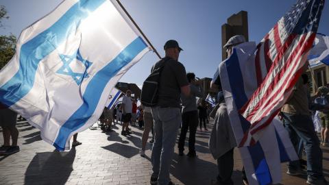 People carry Israeli and American flags during the United for Israel march, led by the Pursuit NW Christian Church, on the University of Washington campus in Seattle, Washington, on May 12, 2024. (Getty Images)