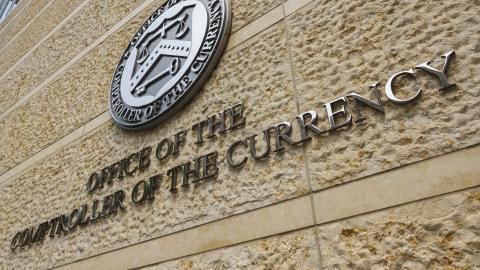 A sign is displayed at the Office of the Comptroller of the Currency (OCC) headquarters on June 1, 2025, in Washington, DC. (Getty Images)