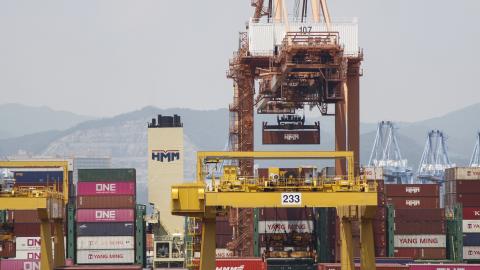 A cargo ship loads and unloads foreign trade containers at Busan Newport in Busan, South Korea, on July 23, 2025. (Getty Images) Share to Twitter