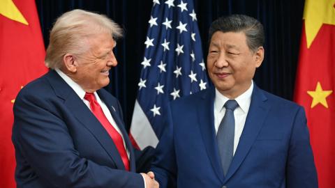 President Donald Trump and China's President Xi Jinping shake hands at the Gimhae Air Base in Busan on October 30, 2025. (Getty Images) Share to Twitter