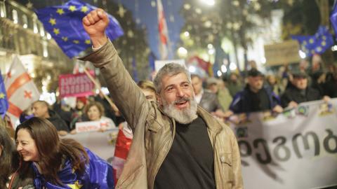 Tbilisi residents protest after the Georgian Dream government announced a suspension of negotiations on EU candidate status until 2028, as police detain demonstrators during a crackdown in the capital on November 28, 2025. (Photo by Sebastien Canaud/NurPhoto via Getty Images)