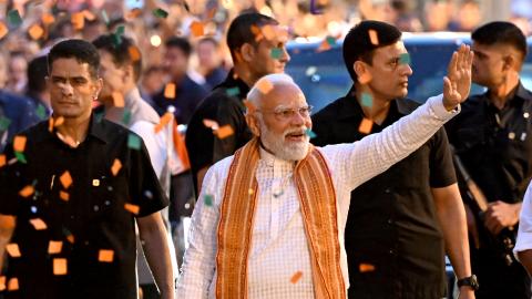 Indian Prime Minister Narendra Modi with Bharatiya Janata Party President Nitin Nabin greets supporters as he arrives at the BJP headquarters to celebrate its election victory on May 4, 2026, in New Delhi, India. (Getty Images)