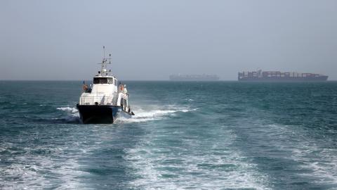 An Iran-flagged passenger vessel Atlas Pishro cruises near ships anchored in the Strait of Hormuz on May 2, 2026. (Getty Images)