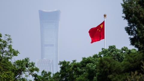 China's national flag flutters in the wind next to the CITIC tower on May 12, 2026, in Beijing, China. (Getty Images)