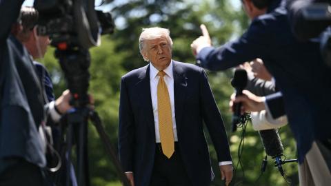 Caption US President Donald Trump speaks to the press on the South Lawn of the White House in Washington, DC, on May 12, 2026. (Getty Images)