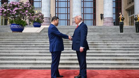 Caption President Donald Trump is greeted by Chinese President Xi Jinping at the Great Hall of the People on May 14, 2026, in Beijing, China. (Getty Images) Share to Twitter