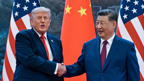 Caption US President Donald Trump shakes hands with China's President Xi Jinping at the Great Hall of the People in Beijing on May 14, 2026. (Getty Images)