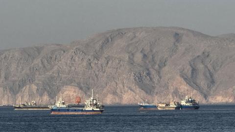 Vessels are seen anchored in the Strait of Hormuz off the port city of Khasab, Oman, on May 17, 2026. (Getty Images)