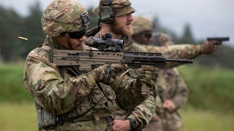 U.S. Army Pfc. Michael Rolli, assigned to Alpha Company, 8th Brigade Engineer Battalion, 2nd Armored Brigade Combat Team, 1st Cavalry Division, shoots a SA80 rifle alongside a British Army soldier, range safety of the Light Dragoons, Forward Land Forces Battle Group-Poland, during close-quarters battle practice, Bemowo Piskie Training Area, Poland, June 11, 2026. U.S. forces in Europe conduct routine training in Poland to enhance interoperability with NATO allies and maintain readiness along the alliance’s 