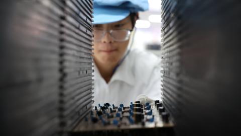 Caption A worker produces integrated circuit products in a workshop in Weihai, Shandong Province, China, on September 9, 2025. (Getty Images) Share to Twitter