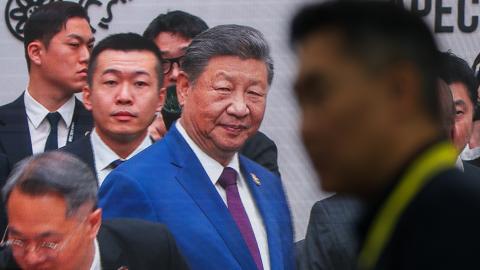 Chinese President Xi Jinping is seen greeting world leaders on a broadcast screen during the APEC Economic Leaders' Week, in Gyeongju, South Korea, on November 1, 2025. (Getty Images)