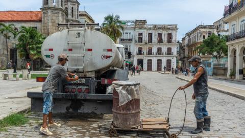 Residents collect water from tanker trucks and carry containers through the streets amid widespread shortages, as seen in Havana, Cuba, on June 4, 2026. (Getty Images)