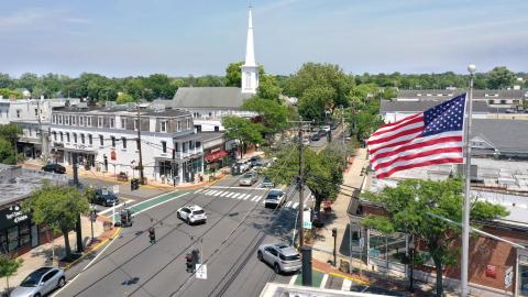 An aerial view of an intersection in downtown Babylon Village, New York, with the steeple of the First Presbyterian Church in the background, on June 26, 2024. (Getty Images)