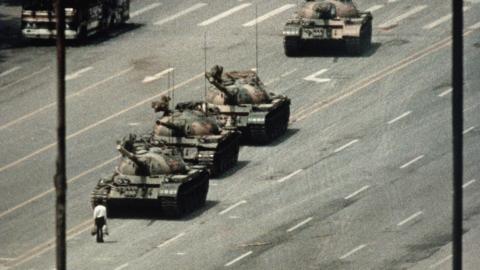 A Beijing demonstrator blocks the path of a tank convoy along the Avenue of Eternal Peace near Tiananmen Square on June 5, 1989. (Getty Images)