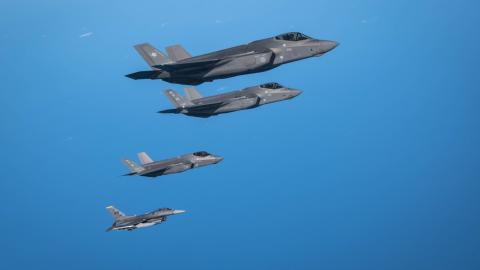 A Japan Air Self-Defense Force F-35A Lightning II flies alongside two F-35A Lightning IIs and an F-16 Fighting Falcon of the US Air Force over the Pacific Ocean near Misawa Air Base in Japan on September 30, 2025. (US Air Force)
