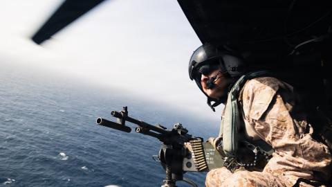 A U.S. Marine with Marine Medium Tiltrotor Squadron (VMM) 265 (Rein.), 31st Marine Expeditionary Unit, conduct flight operations aboard a UH-1Y Venom in the U.S. Central Command area of responsibility, June 15, 2026. (U.S. Marine Corps photo by Sgt. Alora Finigan)