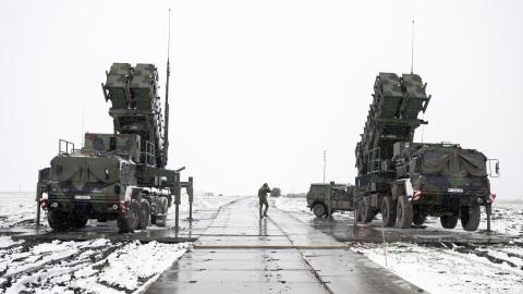 Trailers with launchers for guided missiles of a German Patriot air defense system stand on a snow-covered field in southeastern Poland on April 3, 2023. (Getty Images)