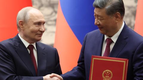 Russian President Vladimir Putin and Chinese President Xi Jinping shake hands during a signing ceremony at the Great Hall of the People on May 20, 2026, in Beijing, China. (Getty Images)