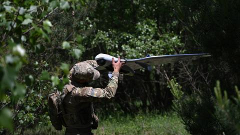 serviceman of the State Border Guard Service of Ukraine prepares an UAV for a patrol flight along the Ukraine-Belarus border in Chernigiv region on June 1, 2026. (Getty Images)