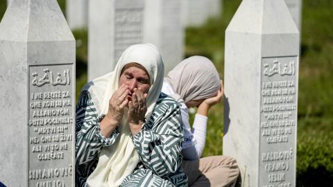 Relatives of victims of the 1995 Srebrenica genocide pray at the graves of their loved ones at the Potocari Memorial Cemetery in Potocari, Bosnia and Herzegovina, on July 11, 2026. (Getty Images)