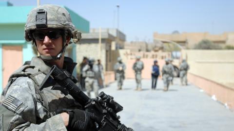 A US soldier pulls security at the al-Faw intermediate school in the Sadr City area of Baghdad on August 15, 2008. (US Army)