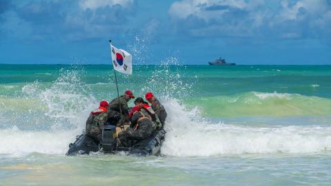 Republic of Korea marines depart shore in a combat rubber raiding craft after ship-to-shore movements as part of Exercise Rim of the Pacific 2026 at Marine Corps Training Area Bellows, Hawaii, July 20, 2026. Thirty nations, 30 ships, five submarines, 15 national land forces, more than 190 aircraft and more than 30,000 personnel are participating in RIMPAC in and around the Hawaiian Islands, June 24 to July 31. The world's largest international maritime exercise, RIMPAC provides a unique training opportunity
