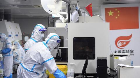 Laboratory technicians work on samples to be tested for the COVID-19 coronavirus at a testing facility in Wuhan, China on August 4, 2021. (Getty Images)