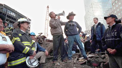 President George W. Bush speaks from the rubble of Ground Zero on September 14, 2001, in New York City. (Getty Images)