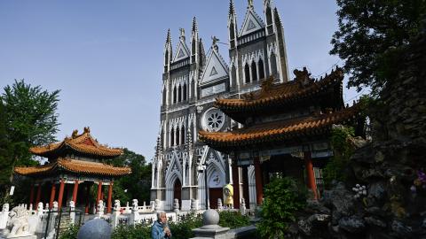 A woman prays at the Xishiku Church in Beijing on April 26, 2025. (Getty Images)
