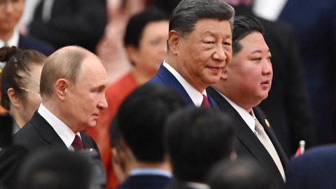 China’s President Xi Jinping, North Korea’s leader Kim Jong Un, and Russia’s President Vladimir Putin arrive for a reception in the Great Hall of the People in Beijing on September 3, 2025. (Getty Images)