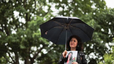 Rushan Abbas holds a photo of her sister, Uyghur doctor Gulshan Abbas, who is detained in China, during the “No Deals Without Freedom” protest at Lafayette Park on May 11, 2026, in Washington, DC. (Getty Images)