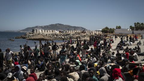 Migrants wait on the beach on August 2, 2026 in Ceuta, Spain. (Getty Images)