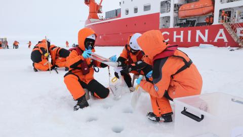 Members of China's 16th Arctic Ocean scientific expedition team work on the ice surface of the Arctic Ocean on Aug. 9, 2026. (Getty Images)