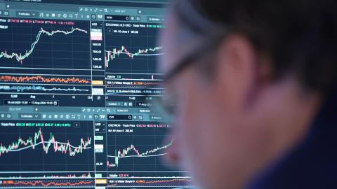 Traders work on the floor of the New York Stock Exchange during morning trading on August 18, 2026, as stocks open lower amid concerns about persistently rising inflation and elevated oil prices. (Getty Images)